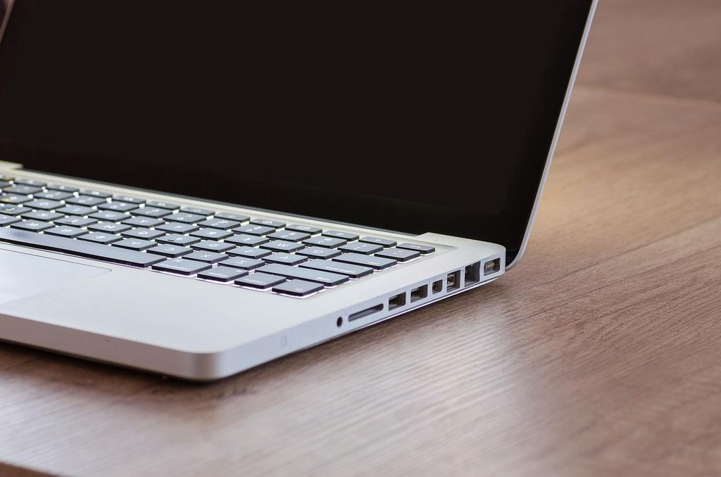A person using a laptop with privacy measures displayed